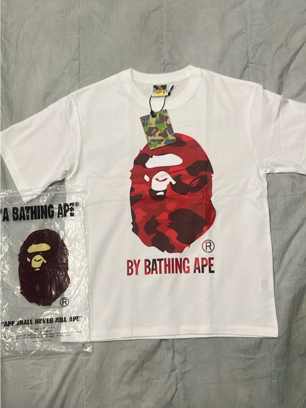 A Bathing Ape White Short Sleeve Tee with Red Camo Ape Head